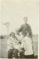  From left to right, Kitty Leota Speed being held by her grandfather, Henry Andrew Lewis Speed, Lucy Abbott Speed (grandmother), and Edith Speed. The small girls were daughters of Charles Speed and Mary Moore Speed.